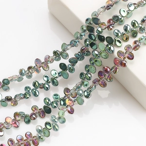 Detailed view of colorful glass crescent moon pendants for DIY jewelry and necklaces