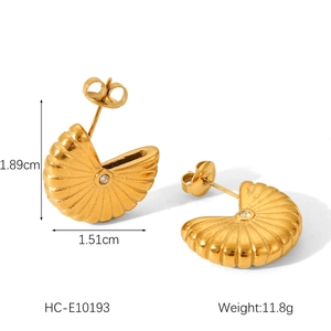 Detailed view of 18K gold bow-shaped stainless steel earrings with sparkling zircon