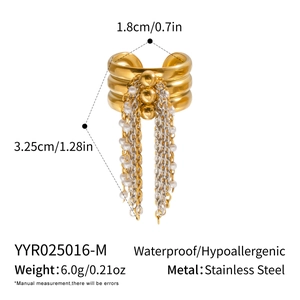 Detail view of gold stainless steel ring featuring pearl tassel and metal beads