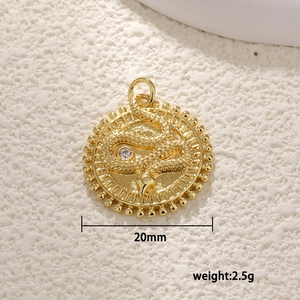 Gold plated snake pendant with embossed relief and zircon detail, 20mm diameter