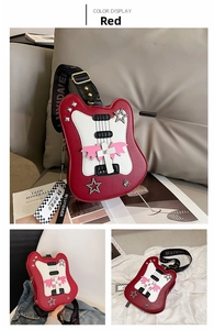 Detail of red guitar shaped crossbody bag with star rivets and wide branded shoulder strap