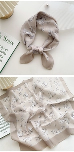 Detail of floral cotton linen neckerchief showing delicate texture and fine hemmed edges