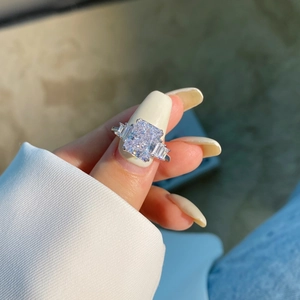 Luxurious S925 sterling silver ring with radiant cut central stone and side trapezoids