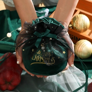 Dark green velvet Christmas gift bag with star mesh drawstring and golden Merry Christmas text
