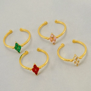 Detail of four adjustable gold-plated rings with marquise-cut colorful zircon flower motifs