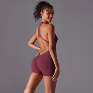 Detail of burgundy backless yoga jumpsuit with ruched peach lift and cutout back