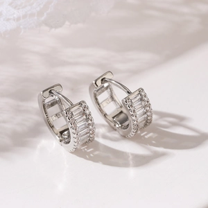 Exquisite silver-plated huggie earrings with baguette and round cut cubic zirconia