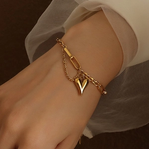 18k gold plated stainless steel heart charm bracelet with layered dual chain design