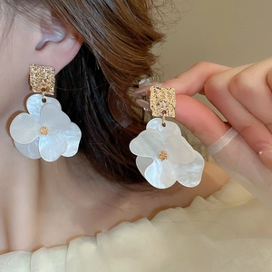 Vintage acrylic flower earrings with golden textured metal squares and pearl petals