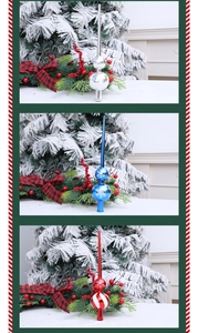 Detailed view of silver, blue and red snowflake pattern finial tree toppers on branches