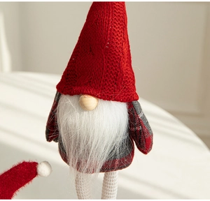 Detailed close-up of a Christmas gnome doll featuring a knitted hat and white faux fur beard