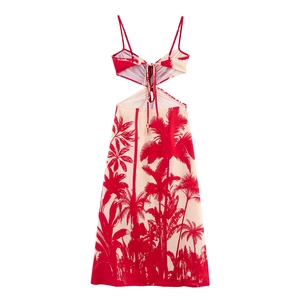 Detail of backless tie-up design and tropical palm print on beige vacation dress