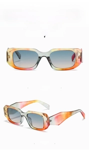 Detail view of square frame sunglasses in floral blue and yellow gradient colors