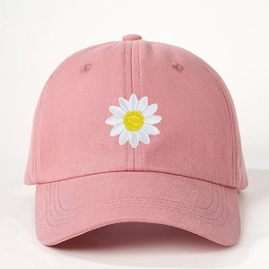Pink cotton baseball cap with white daisy embroidery and adjustable curved brim