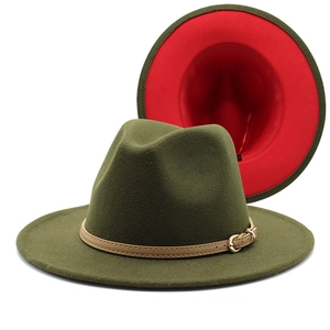 Detail of wool fedora hat in army green with red lining and slim leather belt buckle