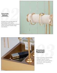 Detailed close-up of golden T-bar jewelry stand with tiered rods and wooden storage tray