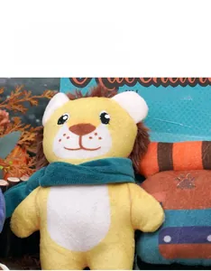 Detail showing the soft lion plush dog toy with wild forest background theme