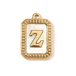 Detailed macro of gold plated rectangle pendant featuring white shell and letter Z