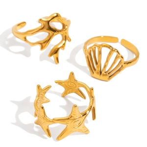 Three-piece ocean themed gold adjustable rings featuring coral, seashell and starfish designs