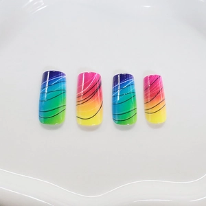Rainbow gradient press-on nails with black wavy lines on white background