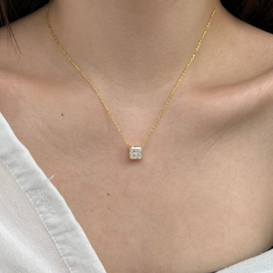 Close-up of S925 silver necklace with princess cut zircon on woman neck