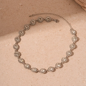 Detailed view of silver choker featuring round crystal clusters and lobster clasp