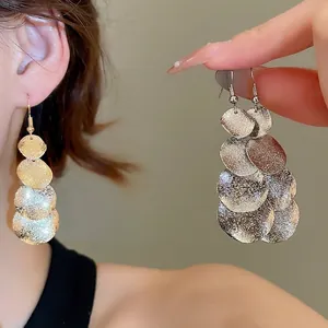 Irregular matte metal sequin tassel earrings with multi-layer round discs and drop hook