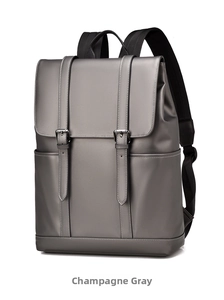 Detailed side view of champagne travel backpack with matte finish and buckle straps