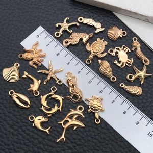 Golden sea life alloy charms featuring starfish and seahorses for DIY jewelry making