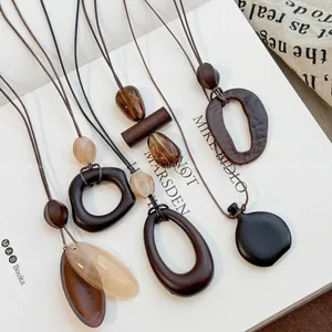 Ethnic retro resin geometric pendant necklaces with brown cords in earth tones