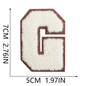 Detailed view of white chenille letter G patch with brown felt backing and dimensions