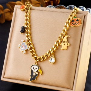 Halloween charm bracelet with pumpkin and ghost charms on 18K gold plated chain