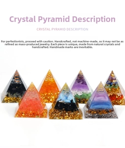Collection of handmade energy crystal pyramids with colorful stones and metal spirals