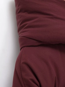 Close-up of wine red hooded cotton jacket showing premium fabric texture and seam detail