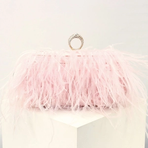 Pink ostrich feather box clutch with a sparkling rhinestone-embellished finger ring handle