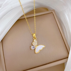 Titanium butterfly necklace with white shell and zircon on a silk jewelry box