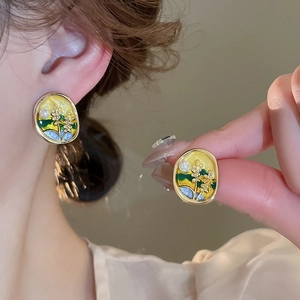 Vintage enamel floral oval earrings with pearl detail and gold-tone metal frames