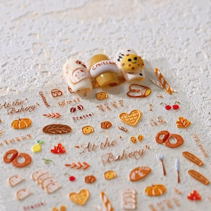 Stickers ongles 3D en relief avec motifs de boulangerie comme croissants et biscuits