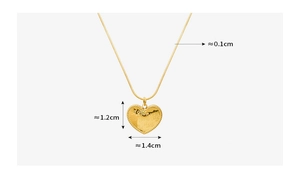 Macro shot of 18K gold plated heart pendant with I Love You engraving and snake chain