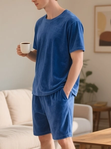 Close-up of men's dark blue velvet lounge set featuring short sleeve t-shirt and shorts