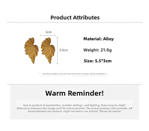 Detailed view of gold leaf earrings with vein texture, 5.5x3cm size, and silver pins