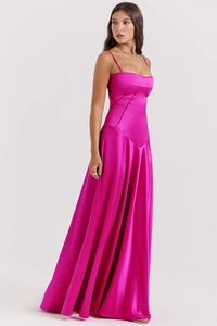 Detail of elegant rose red satin slip dress showing backless cut and silky texture