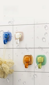 Waterproof adhesive wall hooks in four colors with gold trim and space-saving design