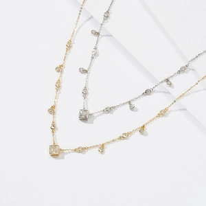 Bohemian style necklace with turquoise accents and pearls in gold and silver finishes