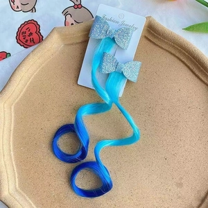 Pair of blue sequin bow hair clips with gradient wavy hair extensions for girls