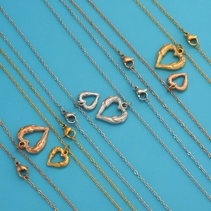 Detailed view of heart pendants in gold, silver, and rose gold with different sizes