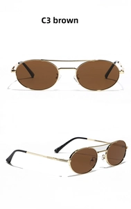 Detail view of vintage gold metal double bridge sunglasses with brown gradient lenses