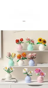 Macro detail of various building block flower bouquets including roses and lilies in mini vases