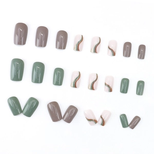 Short square press-on nails in Morandi green and grey with wavy gold glitter patterns