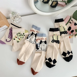 Detail of 5-pack women's cotton socks with cute cartoon animal patterns in soft colors